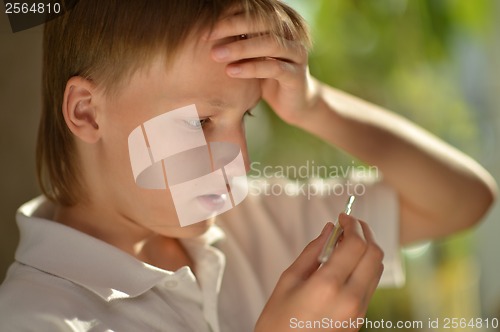 Image of boy fell ill with the flu