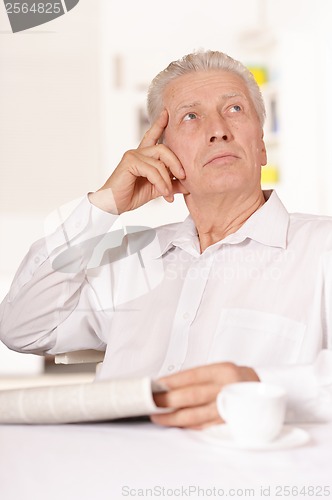 Image of Senior man with newspaper