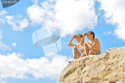 Image of Two boys on a hill