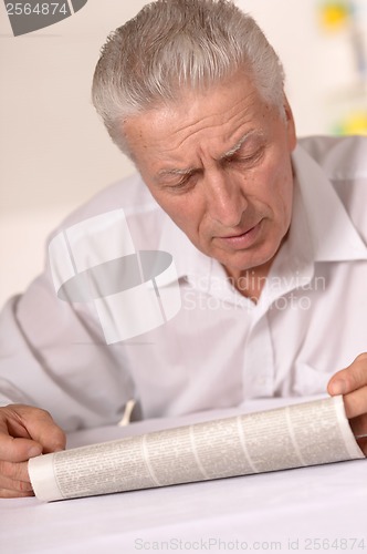 Image of Senior man with newspaper