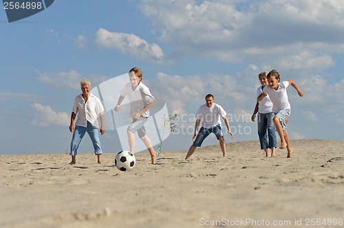 Image of Family playing football