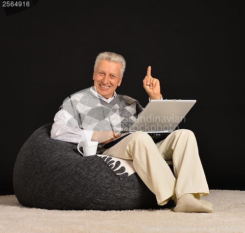 Image of Elderly man with laptop