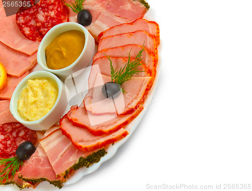 Image of sliced smoked ham sausage appetizer with mustard, horseradish an