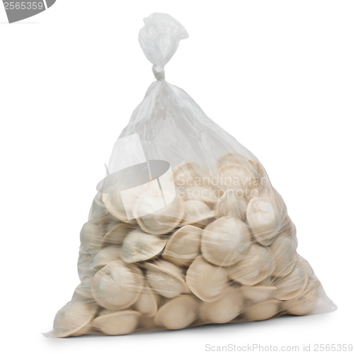 Image of raw dumplings in plastic cellophane bag isolated on white backgr