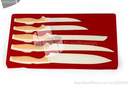 Image of set red of knives for kitchen isolated