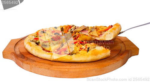 Image of Appetizing pizza with cheese on cut piece of a wooden tray close