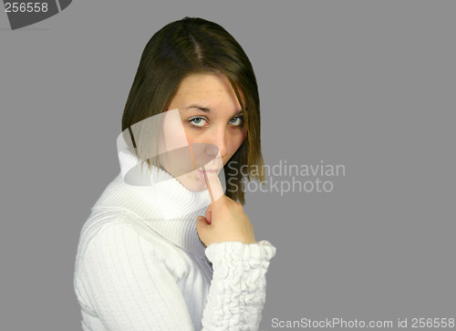 Image of female with finger in mouth