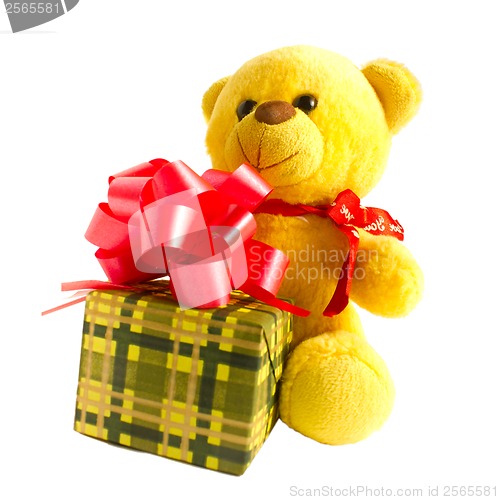 Image of yellow teddy bear with gift