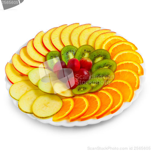 Image of Salad of apples oranges grapes kiwi fruit slices on a plate isol