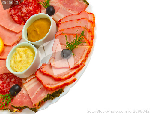 Image of sliced smoked ham sausage appetizer with mustard, horseradish an