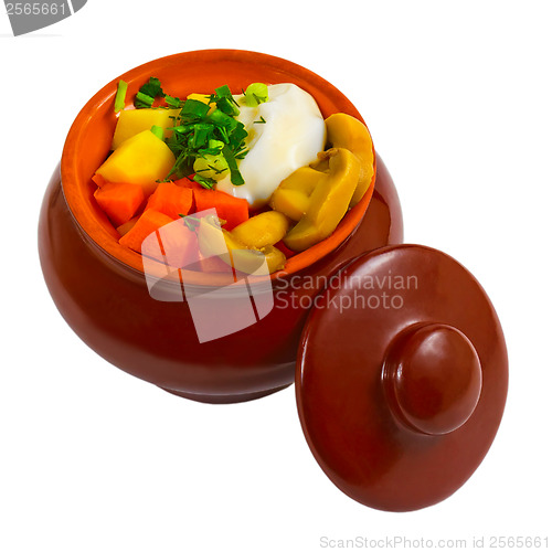 Image of stewed potatoes with meat, mushrooms and carrots and onions in c