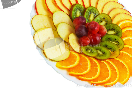 Image of plate apple kiwi a grapes sliced isolated on white background cl