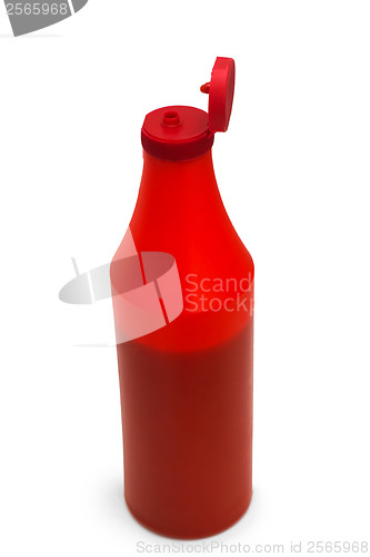 Image of red plastic ketchup bottle isolated on white