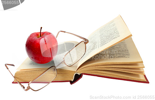 Image of open book and glasses red apple on a white background (clipping 