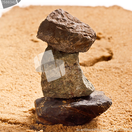 Image of pile of stones in the sand