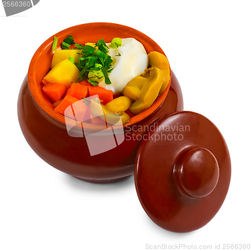 Image of stewed potatoes with meat, mushrooms and carrots and onions in c