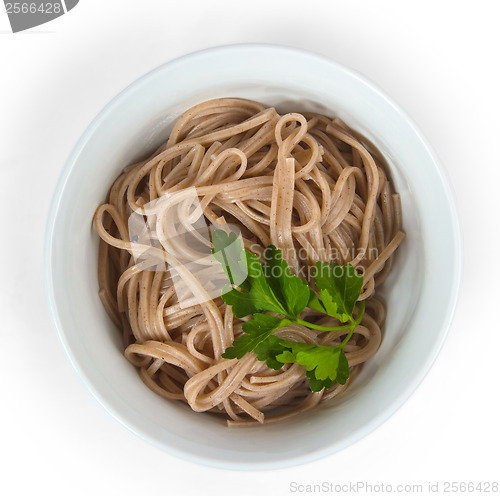 Image of dark pasta in a bowl isolated on white background