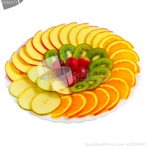 Image of Salad of apples oranges grapes kiwi fruit slices on a plate isol