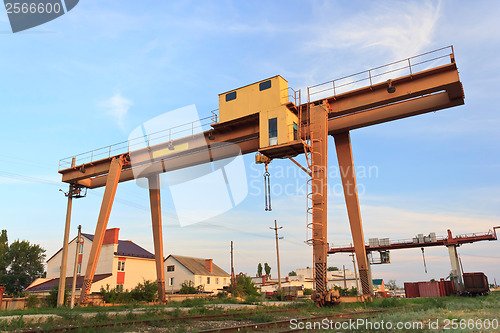 Image of railway crane in Russia against the blue sky