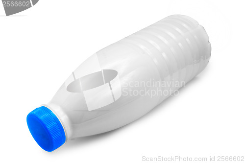 Image of plastic milk bottle lies on side isolated on white (clipping pat