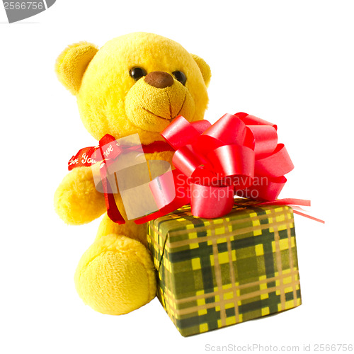 Image of teddy bear paw isolated yellow and gift boxes