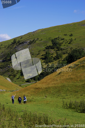 Image of Group of people walking in hills