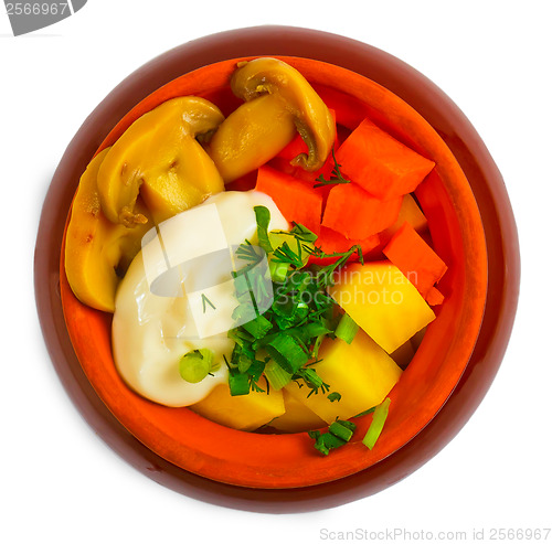 Image of potatoes stewed meat, mushrooms and carrots and onions in cerami