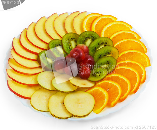 Image of plate apple a kiwi grapes sliced isolated on white background