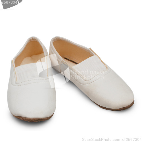 Image of old children's white pointe shoes ballet slippers isolated