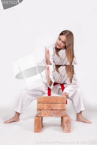 Image of Karate girl breaks bricks 1