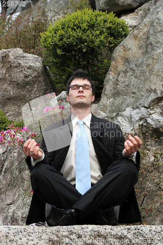 Image of Meditating businessman