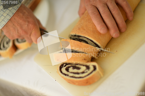 Image of man hands closeup cutting pie