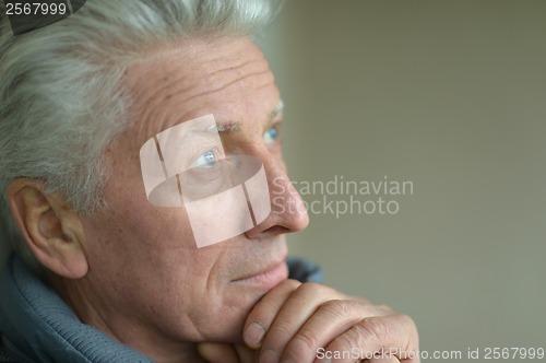 Image of Thinking elderly man