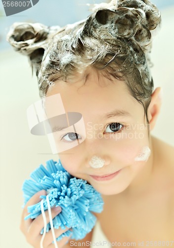 Image of Little girl in bath