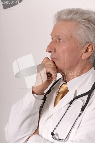 Image of senior doctor on white