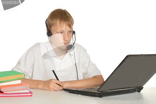 Image of Teenage boy doing homework