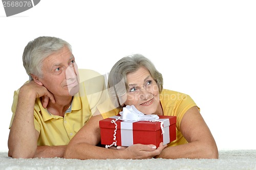 Image of Happy older couple with gift