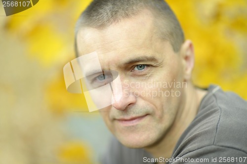 Image of Attractive man in autumn