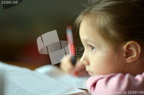 Image of Little girl writing