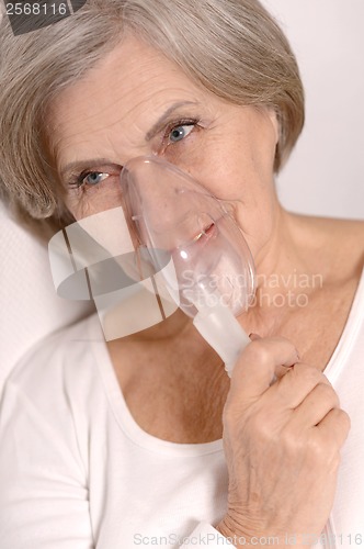 Image of Woman making inhalation.