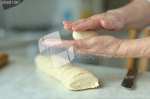 Image of Woman making dough