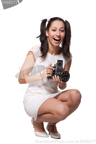 Image of Retro woman with an old camera