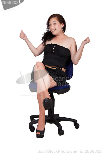 Image of Long-haired woman on a chair