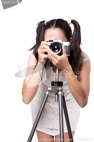 Image of Retro woman with an old camera