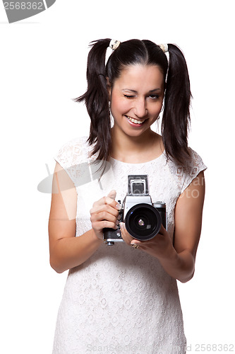 Image of Retro woman with an old camera