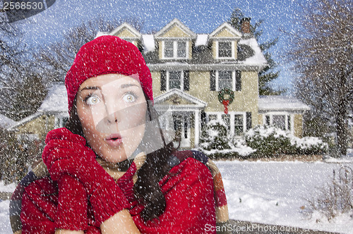 Image of Smiling Mixed Race Woman in Winter Clothing Outside in Snow