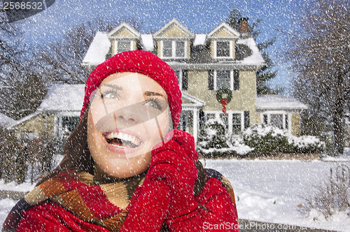 Image of Smiling Mixed Race Woman in Winter Clothing Outside in Snow