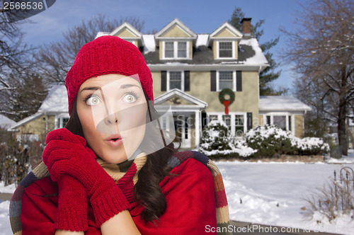 Image of Smiling Mixed Race Woman in Winter Clothing Outside in Snow