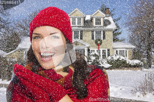 Image of Smiling Mixed Race Woman in Winter Clothing Outside in Snow