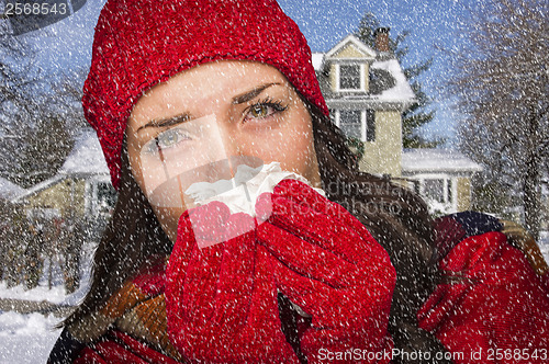 Image of Sick Woman In Snow Blowing Her Sore Nose With Tissue